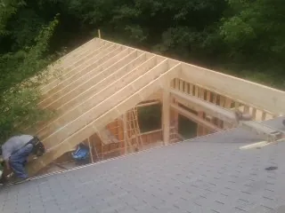 Framing a new roof addition that ties into an existing shingle roof in Martins Ferry